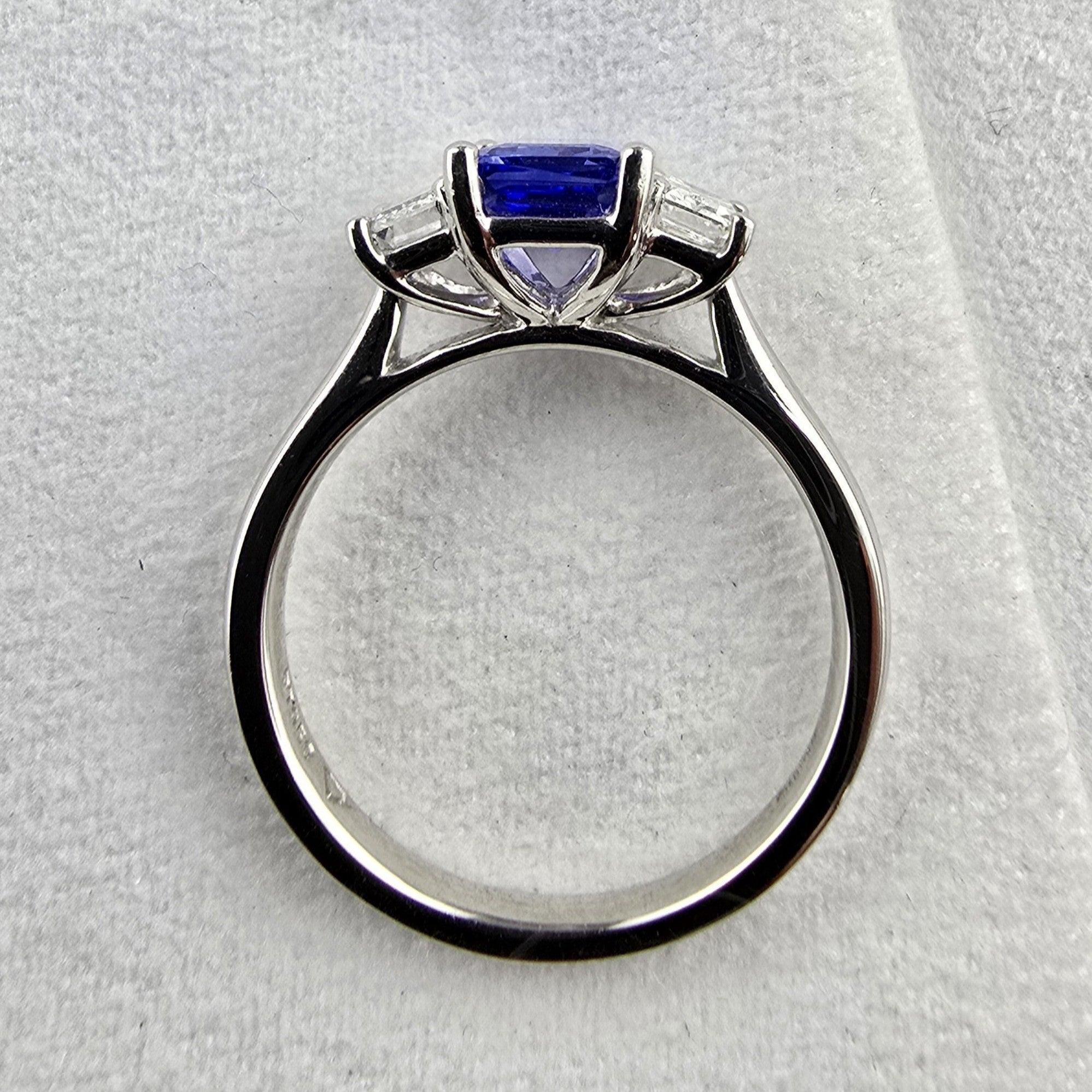 Octagonal cut tanzanite and diamond three stone ring