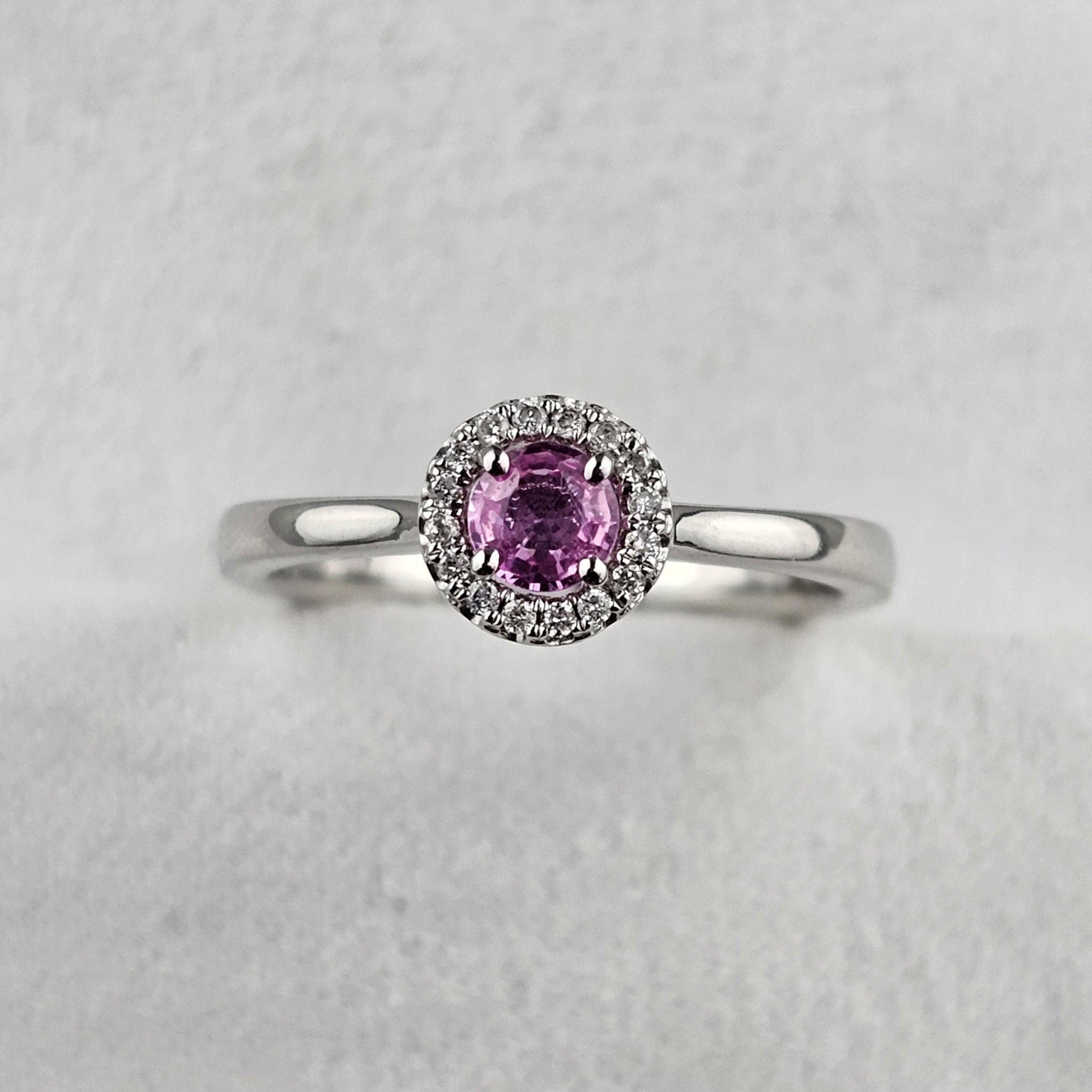 Round Cut Pink Sapphire and Diamond Halo Ring