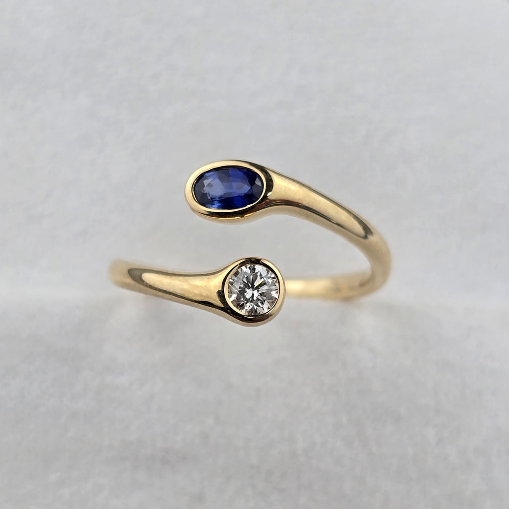 Open Twist Oval Sapphire and Round Diamond Ring