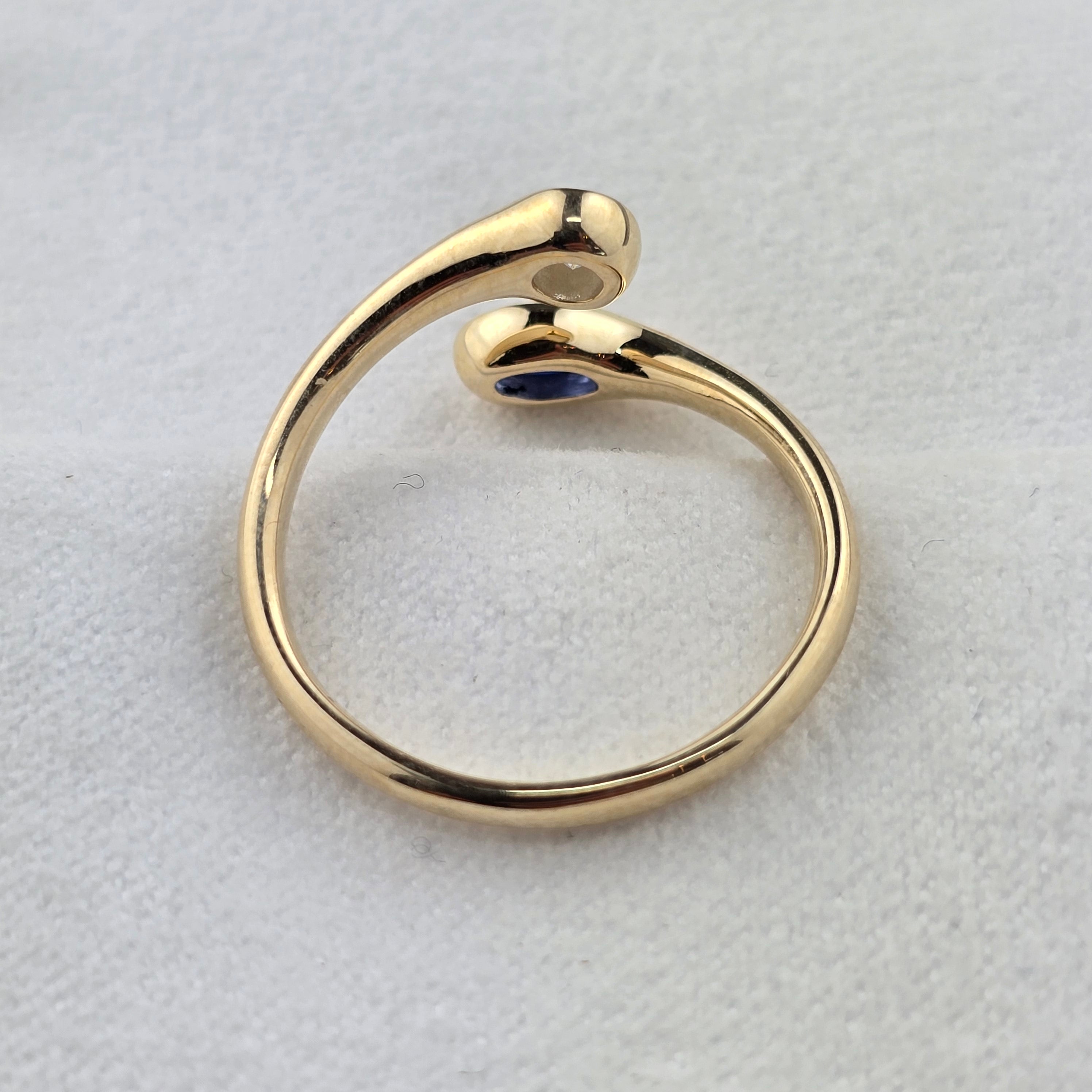 Open Twist Oval Sapphire and Round Diamond Ring