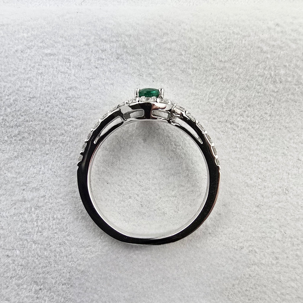 Oval Emerald and Diamond Halo Ring