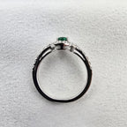 Oval Emerald and Diamond Halo Ring