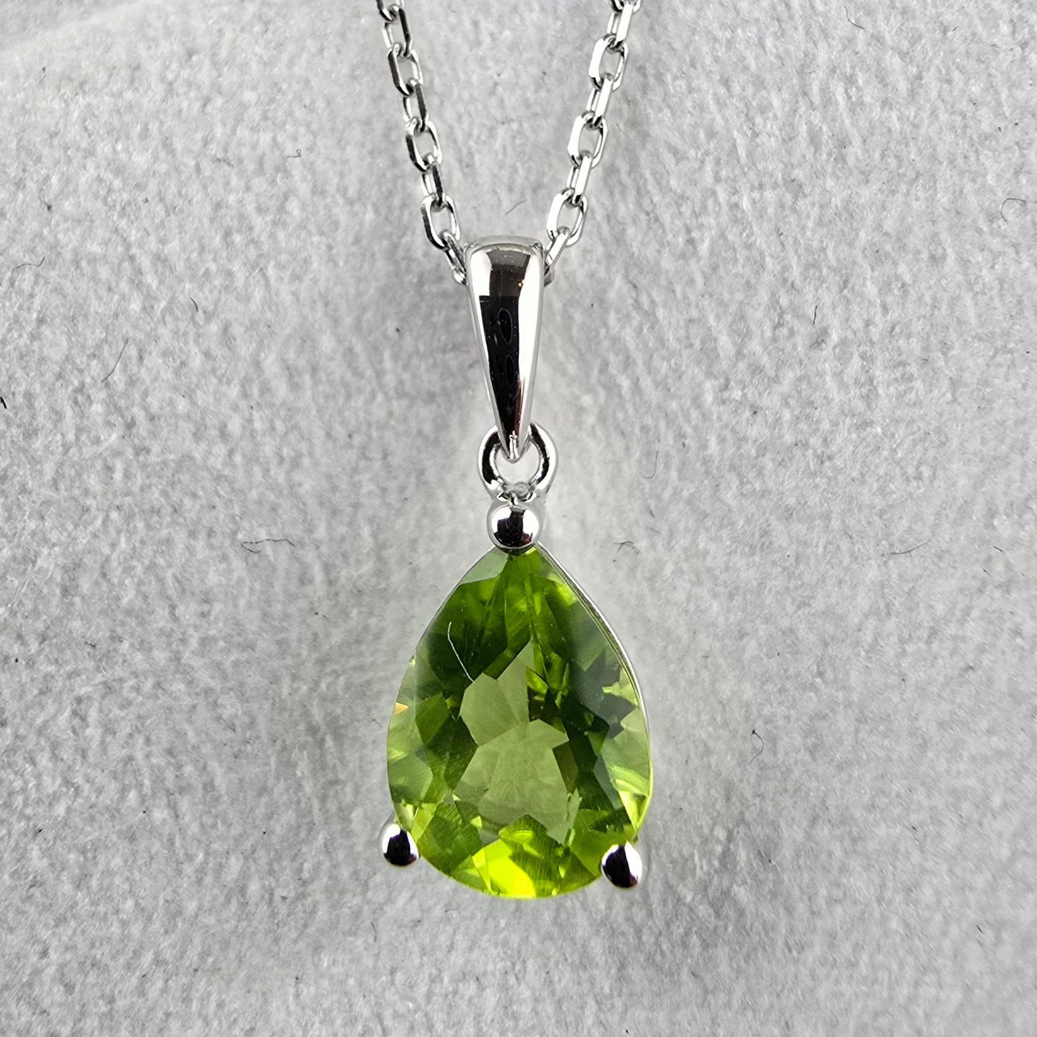 Pear Cut Caw Set Peridot Pendant