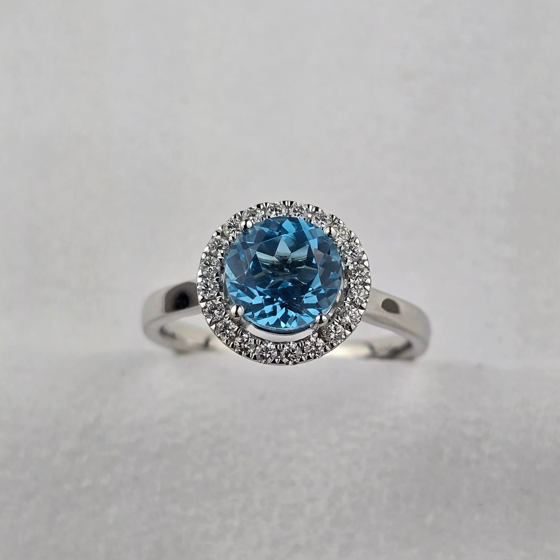 Swiss blue topaz round halo ring