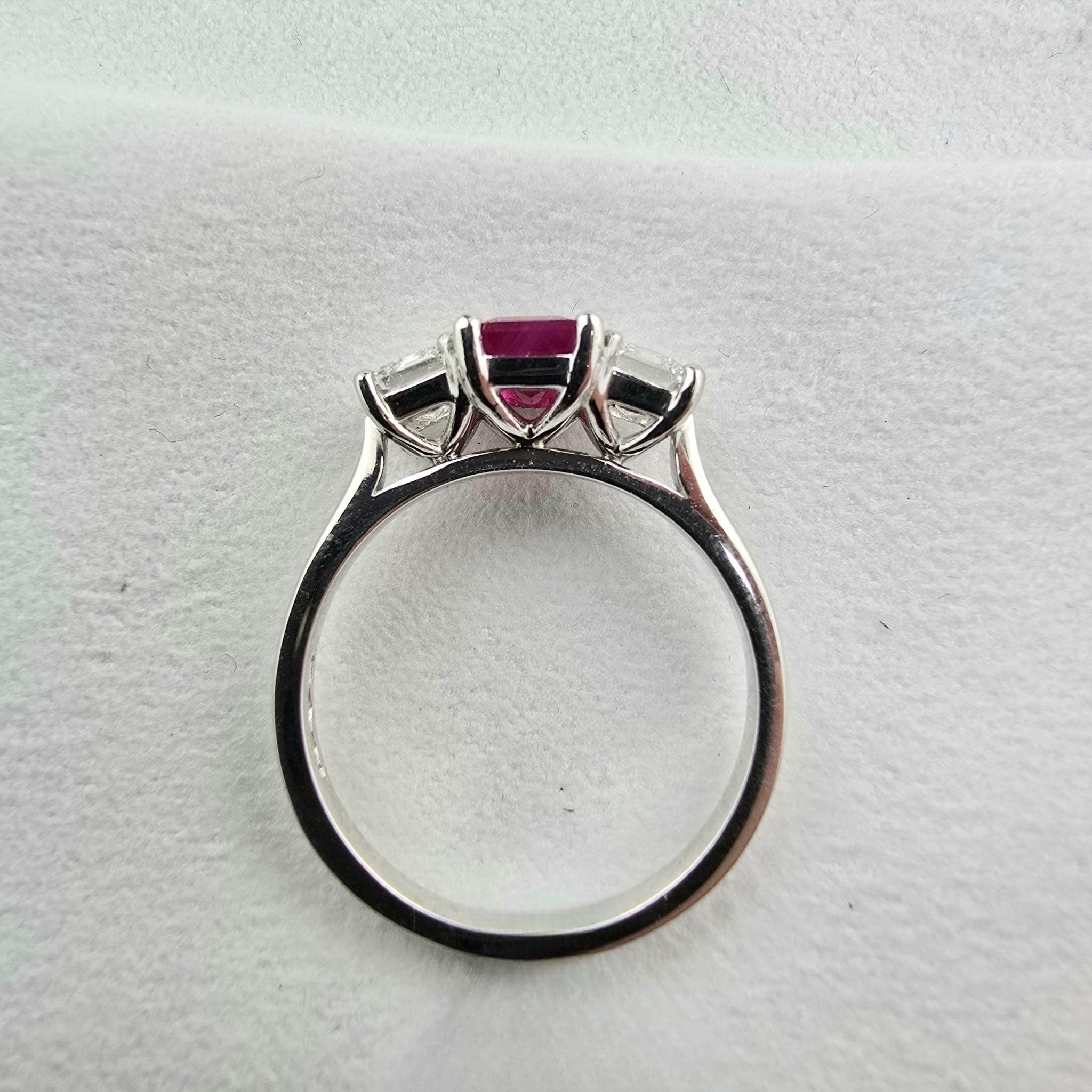 Emerald cut ruby and diamond trilogy ring
