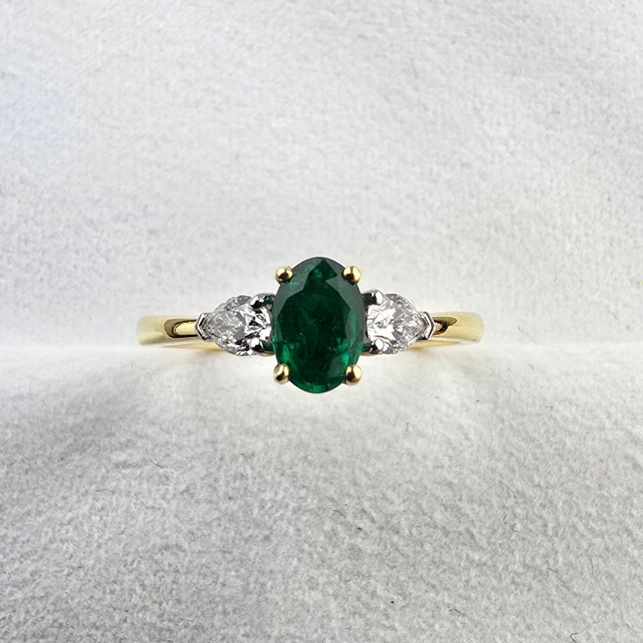 Oval emerald and diamond trilogy ring