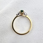 Oval emerald and diamond trilogy ring
