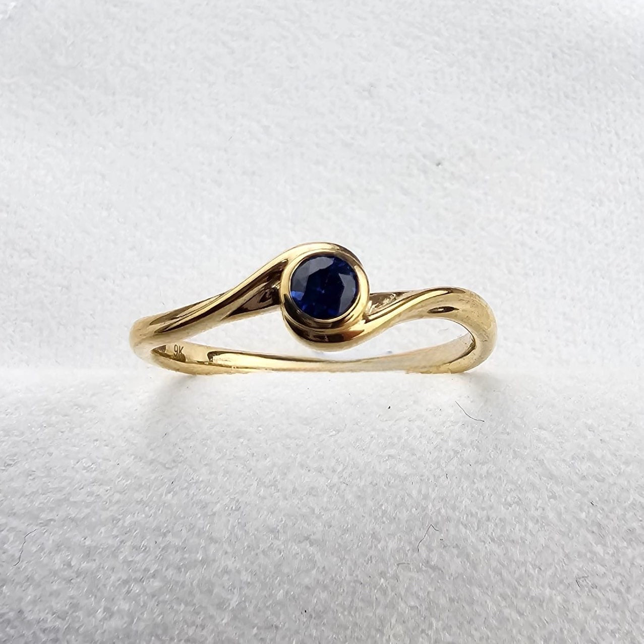 Round Sapphire Crossover Ring