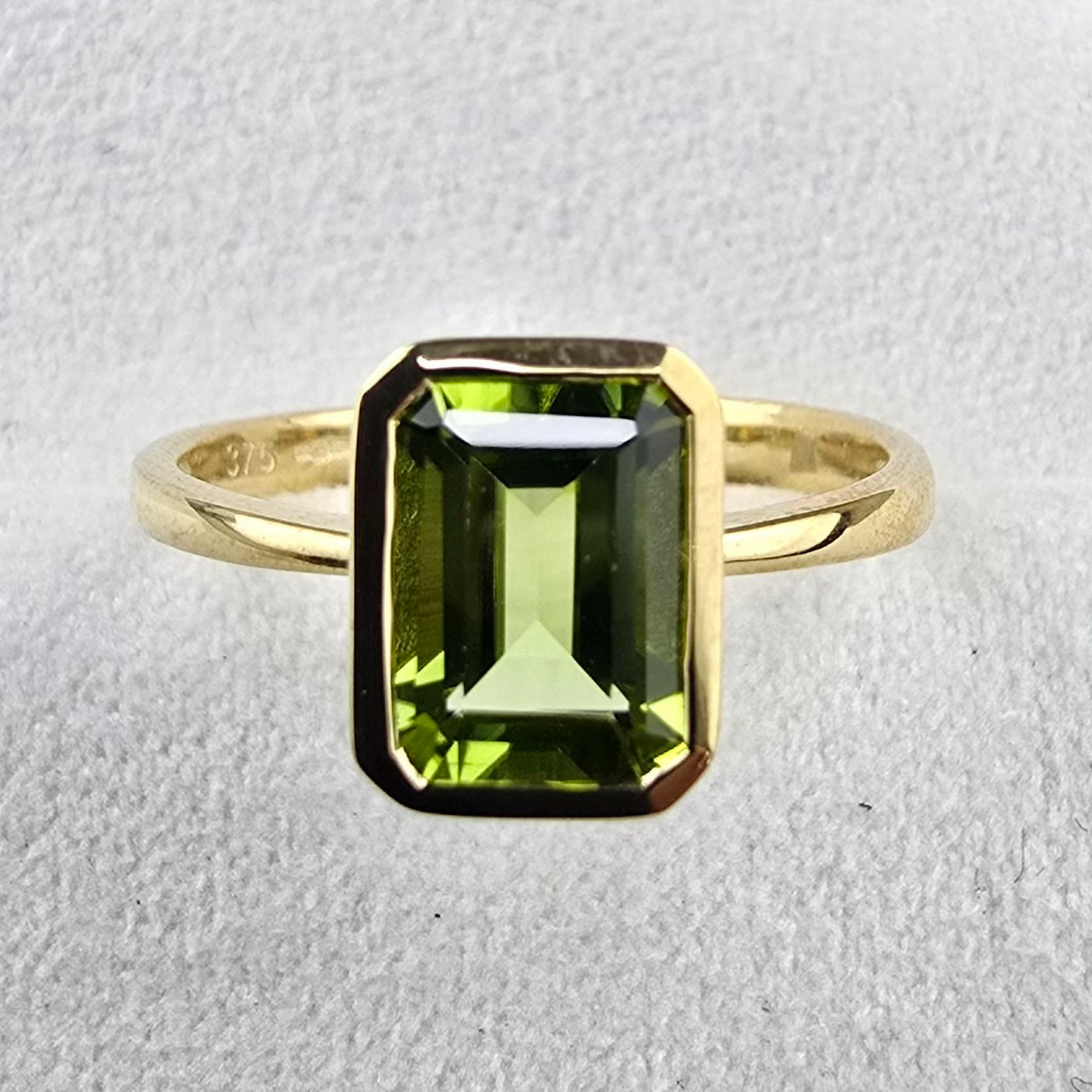 Octagonal Rubover Set Peridot ring