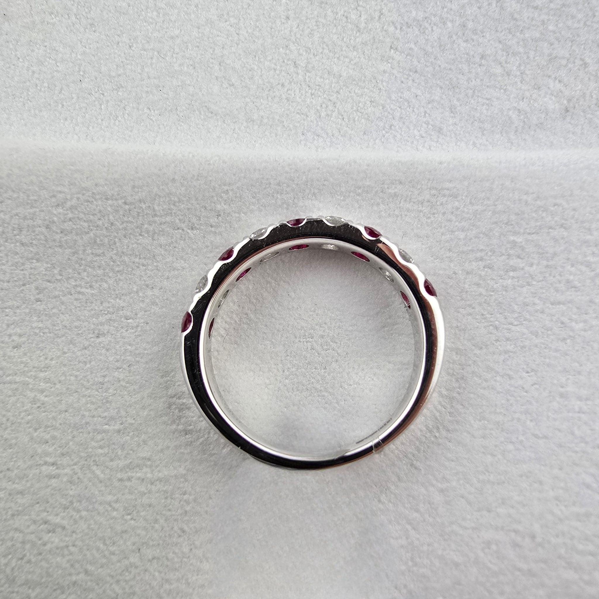 Large ruby and diamond eternity ring