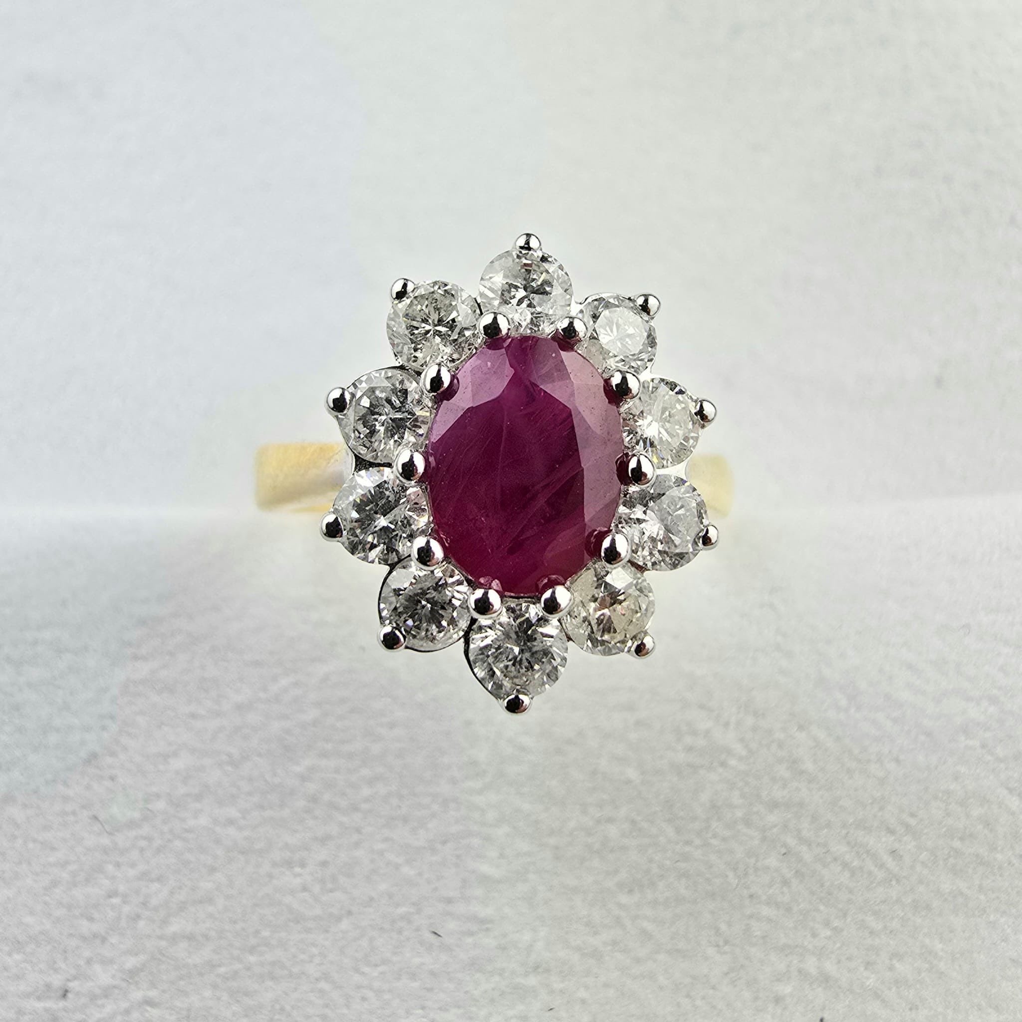 Emerald cut ruby and diamond cluster ring