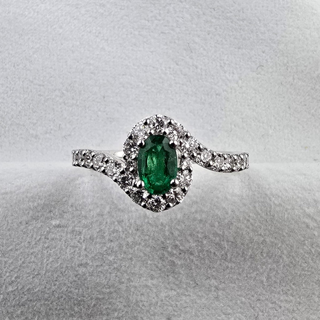 Oval Emerald and Diamond Halo Ring