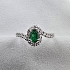 Oval Emerald and Diamond Halo Ring
