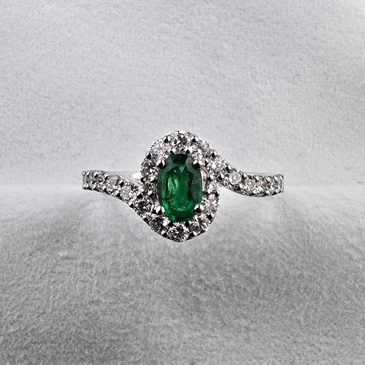 Oval Emerald and Diamond Halo Twist Ring