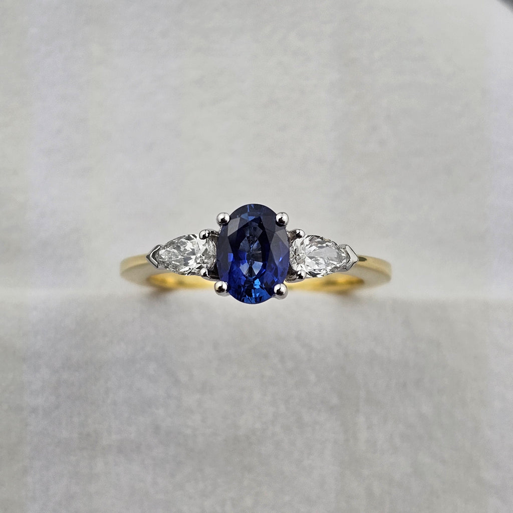 Oval sapphire and pear diamond three stone ring