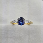 Oval sapphire and pear diamond three stone ring