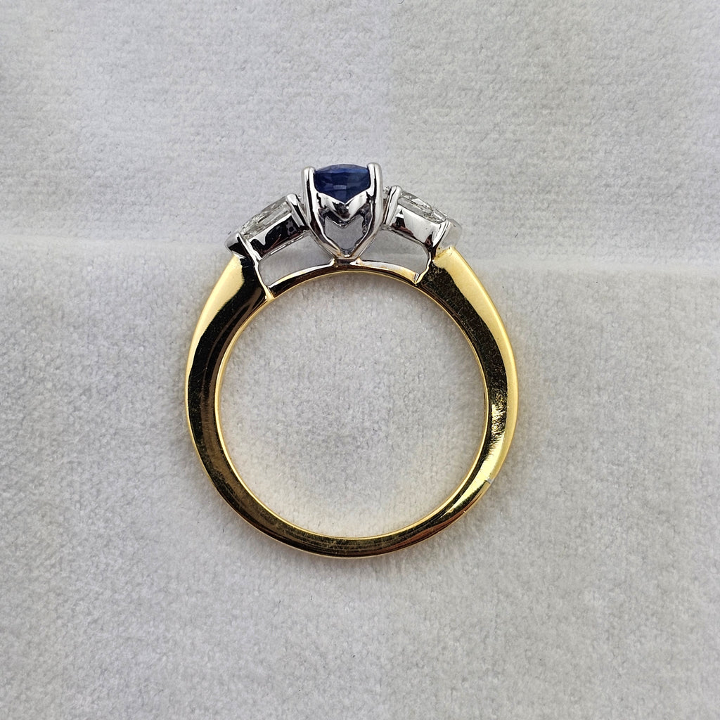 Oval sapphire and pear diamond three stone ring