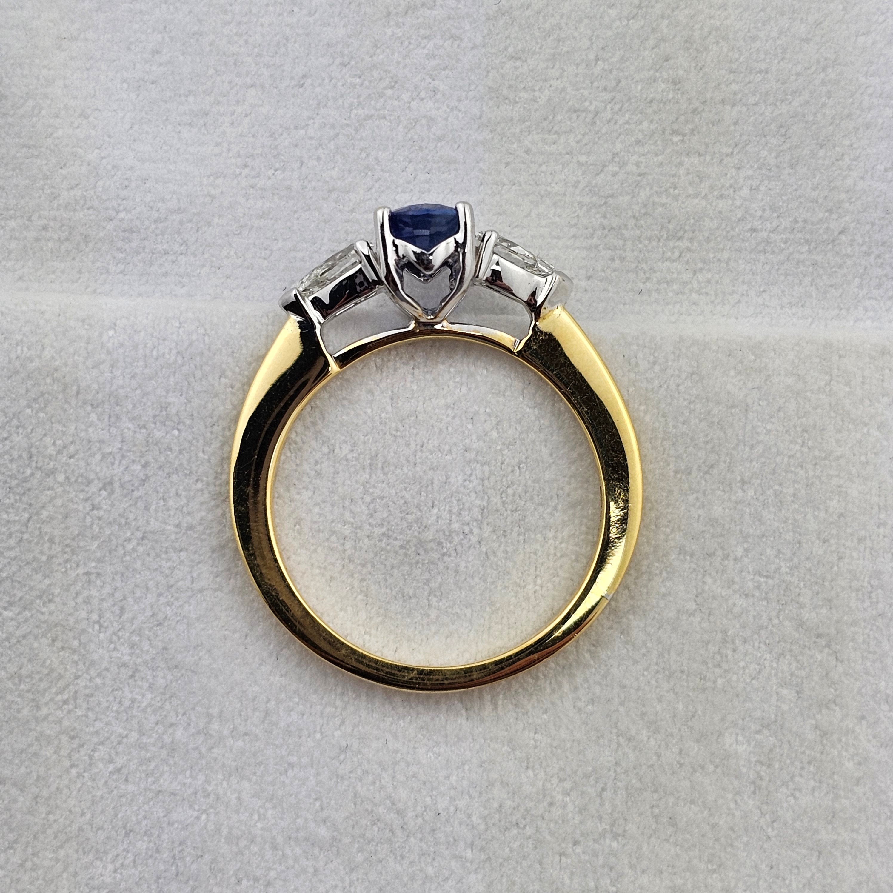 Oval sapphire and pear diamond three stone ring