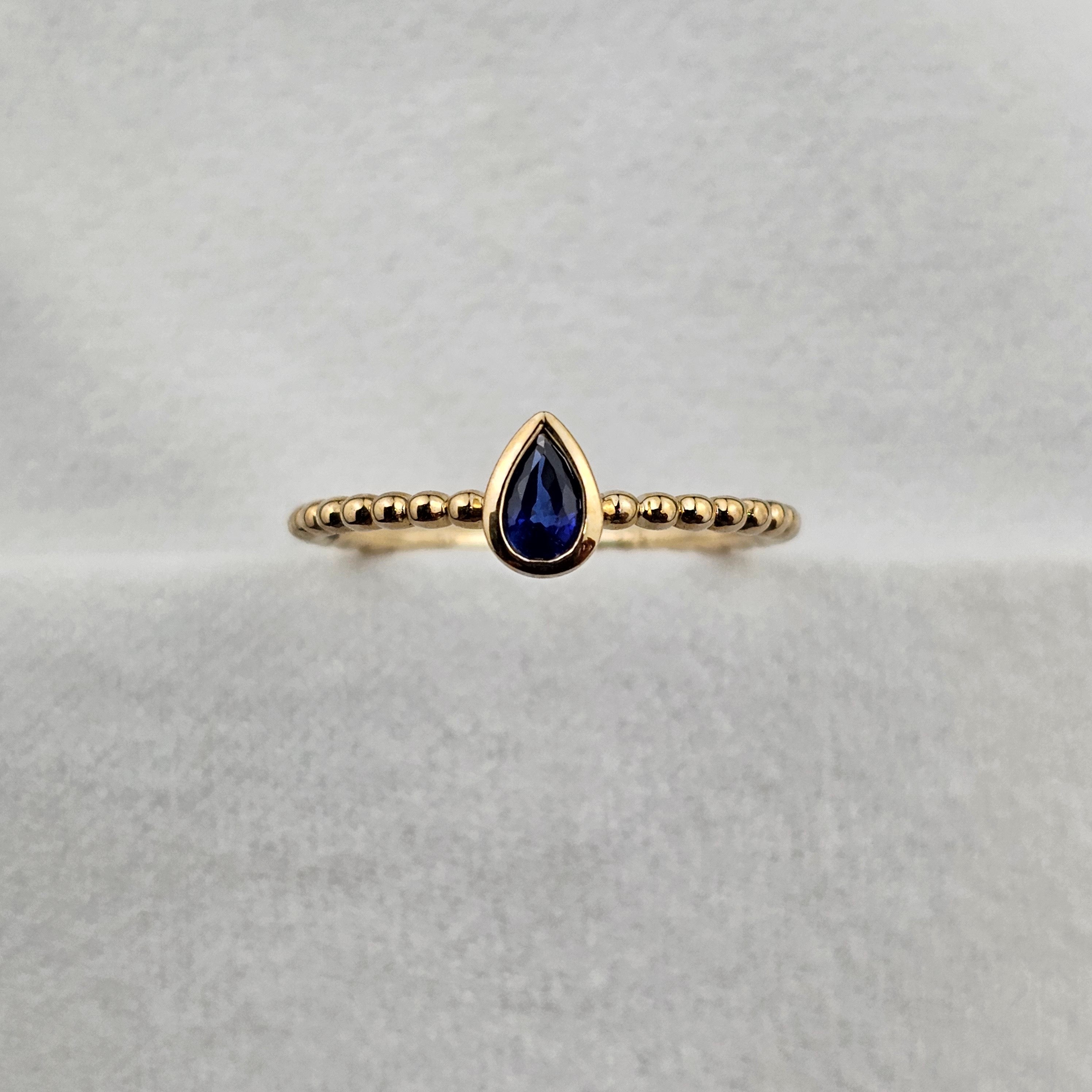 Pear sapphire beaded ring