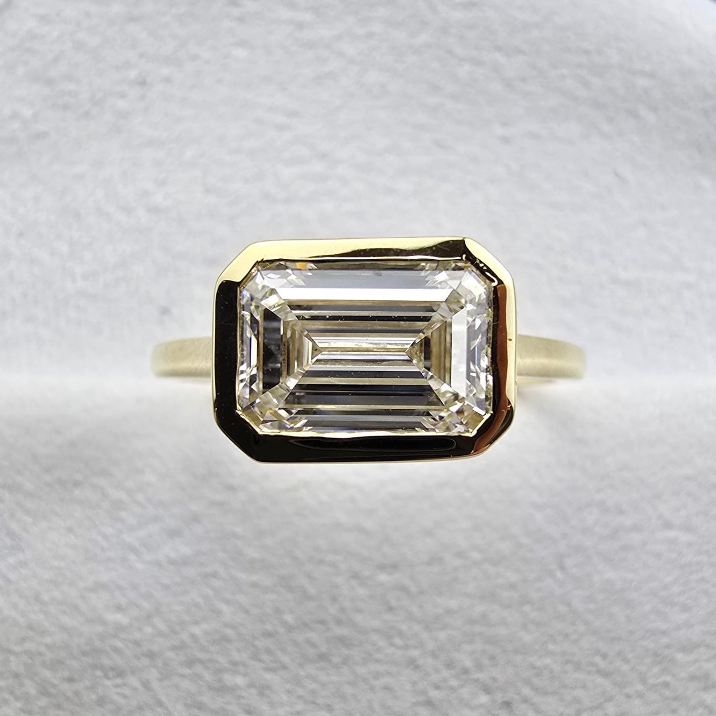 Lab Grown Bezel Set East to West Emerald Solitaire