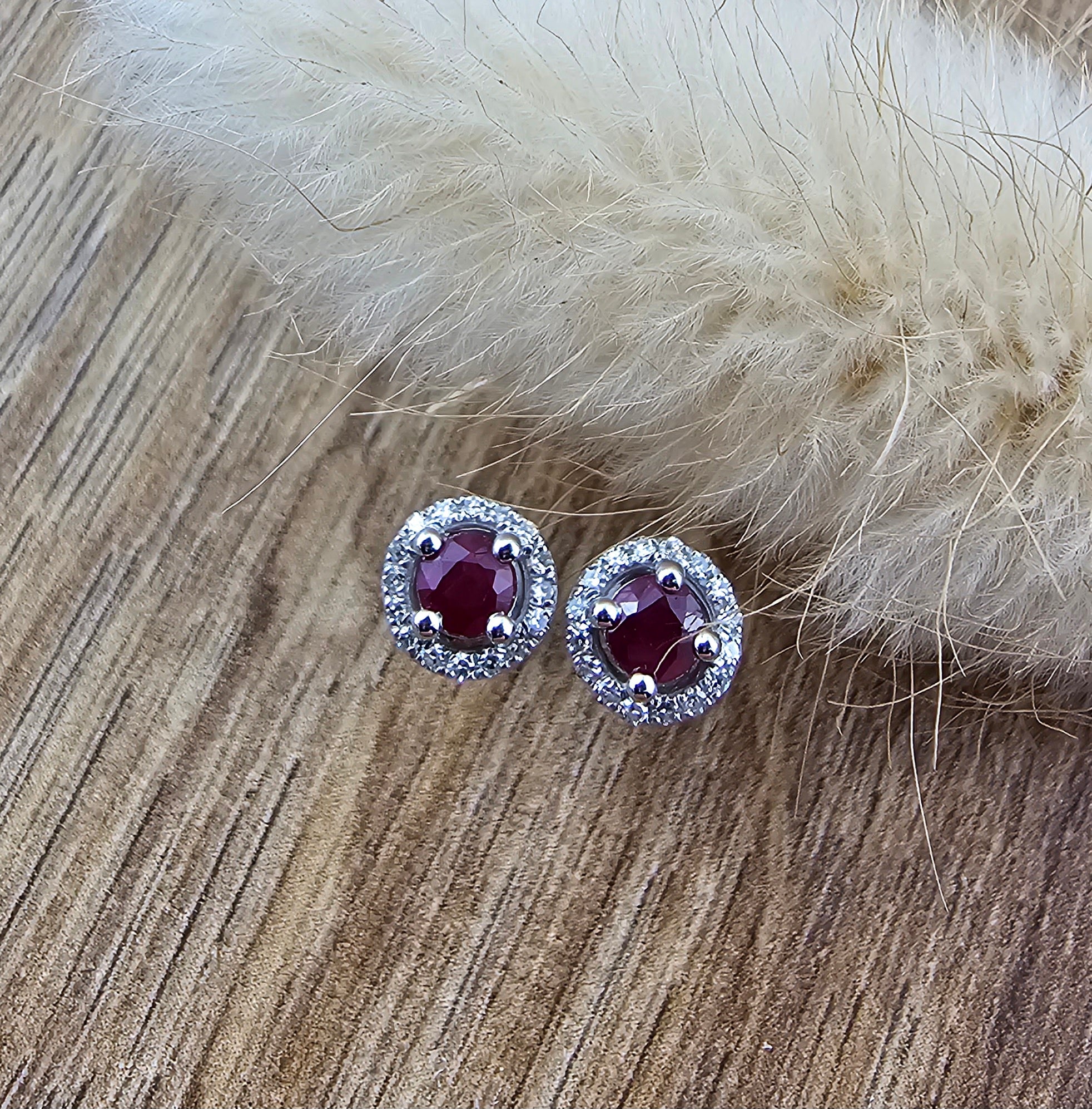 Round ruby halo stud earrings