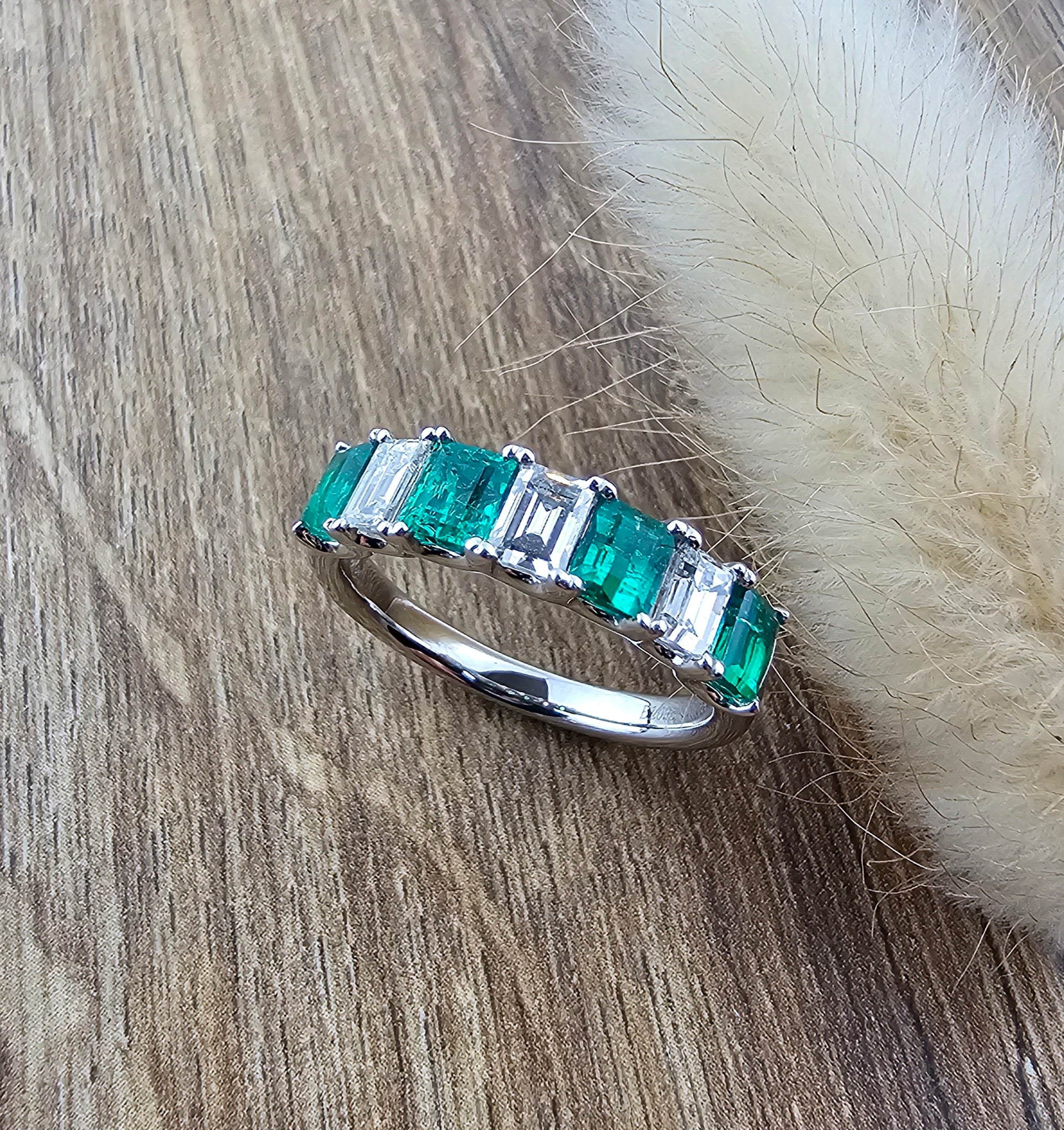 Octagonal emerald and diamond seven stone ring