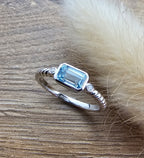 Octagonal blue topaz ring