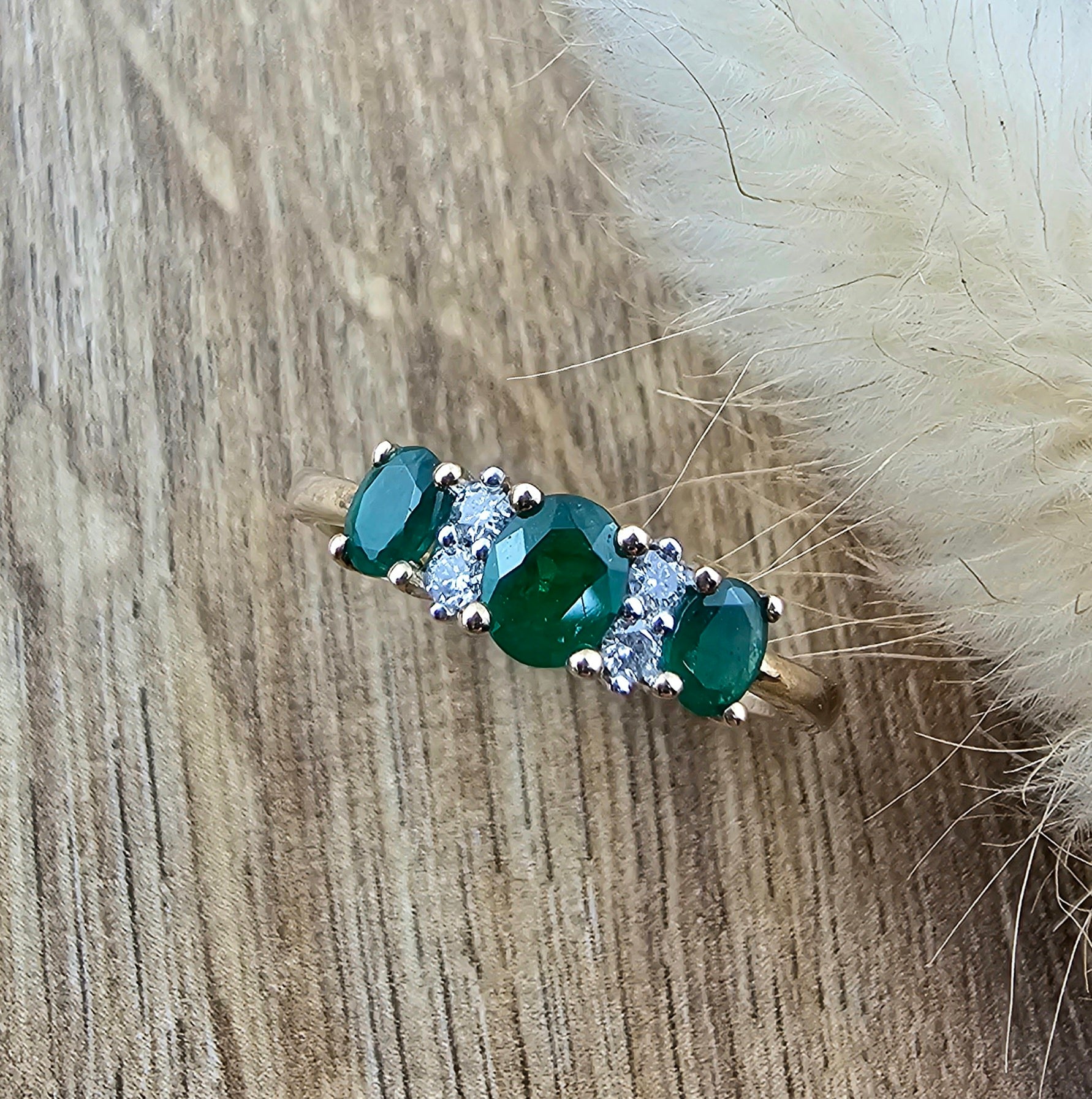 Oval triple emerald dress ring