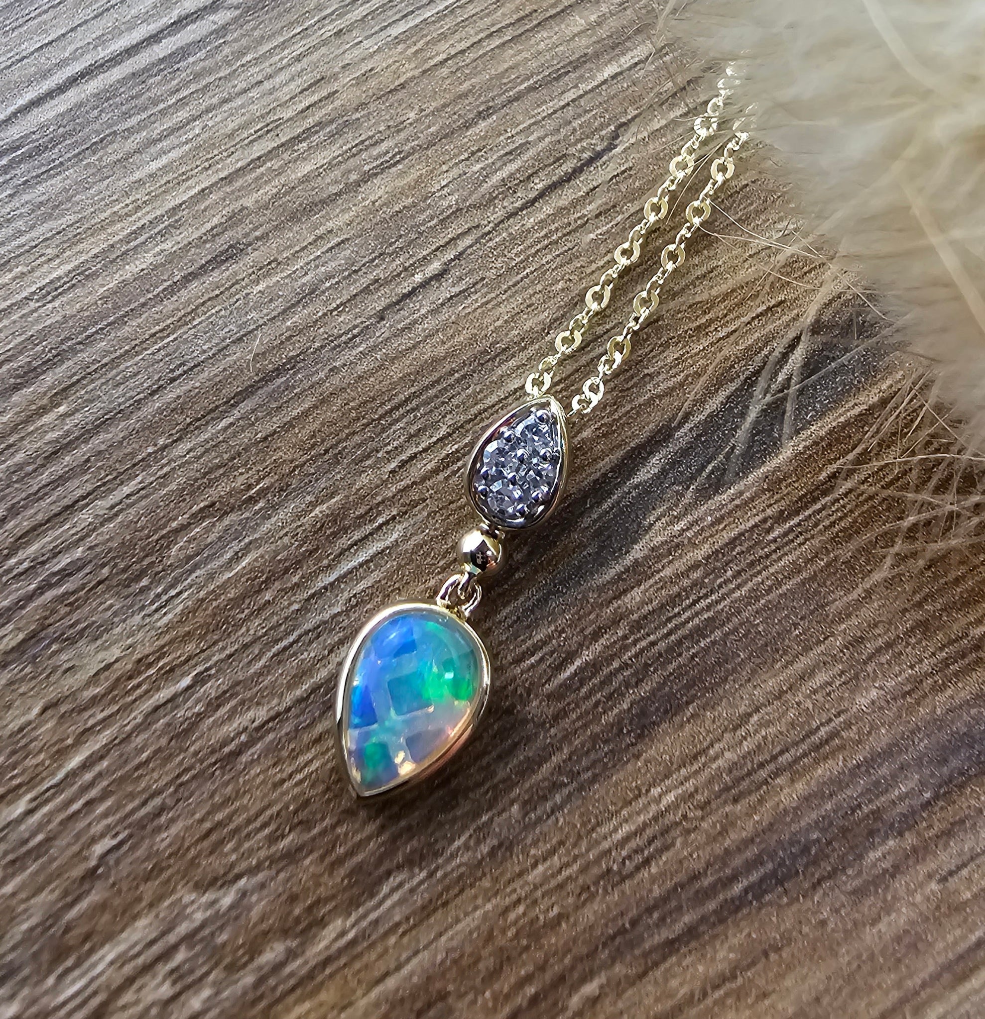 Teardrop opal and diamond pendant