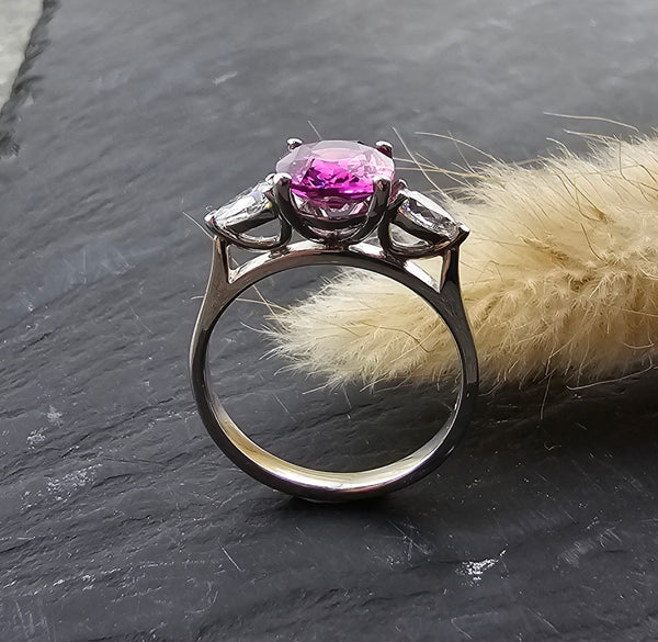 Pink sapphire and diamond three stone ring