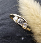 Diamond trilogy tension set ring