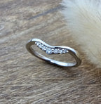 Offset curved diamond set band