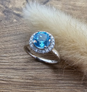 Swiss blue topaz round halo ring