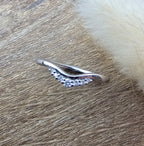 Offset curved diamond set band