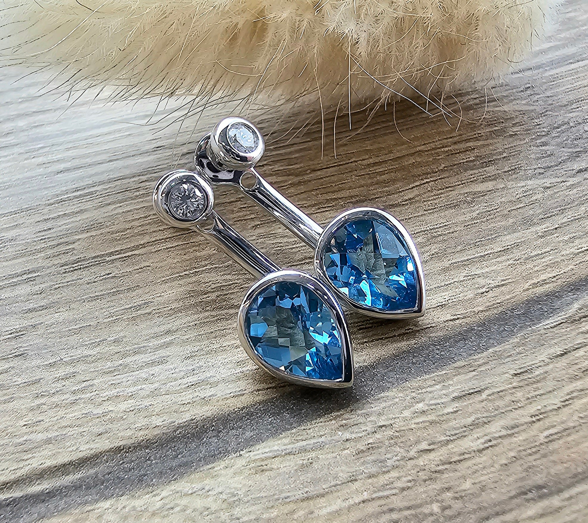 Pear shaped blue topaz convertible earrings