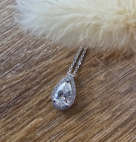 Pear cut diamond halo pendant