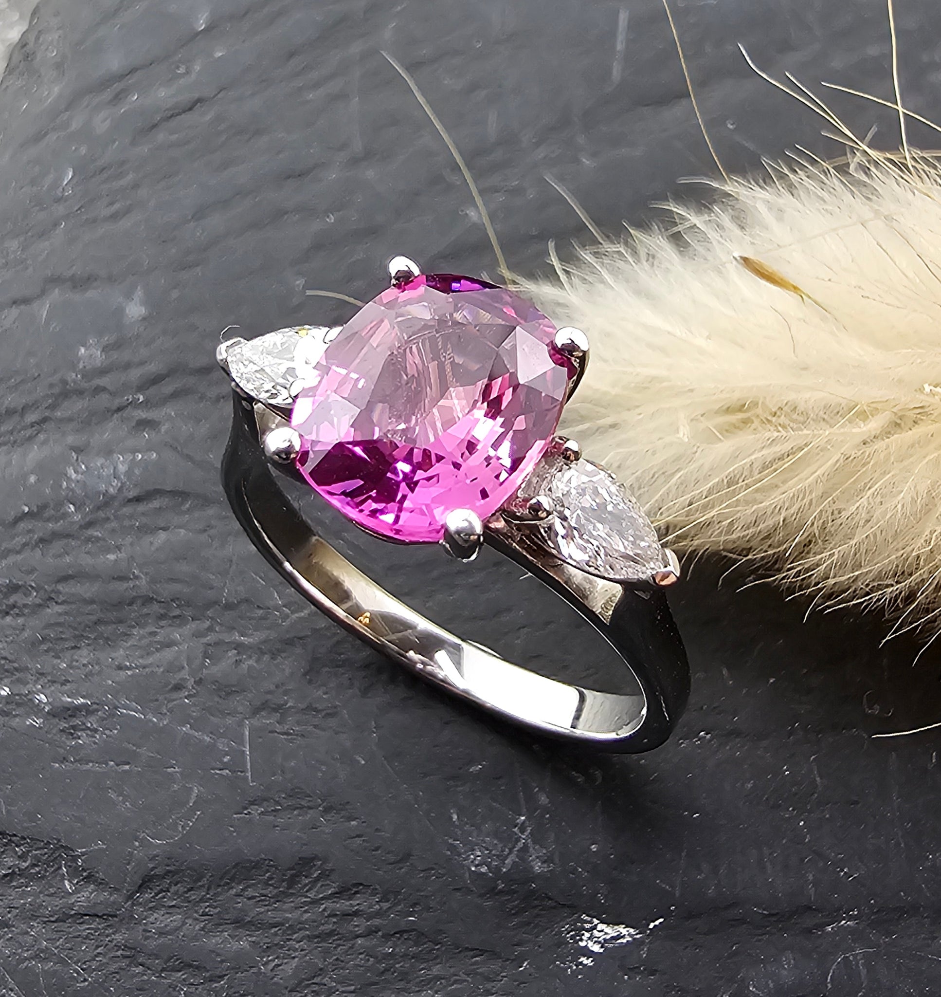 Pink sapphire and diamond three stone ring