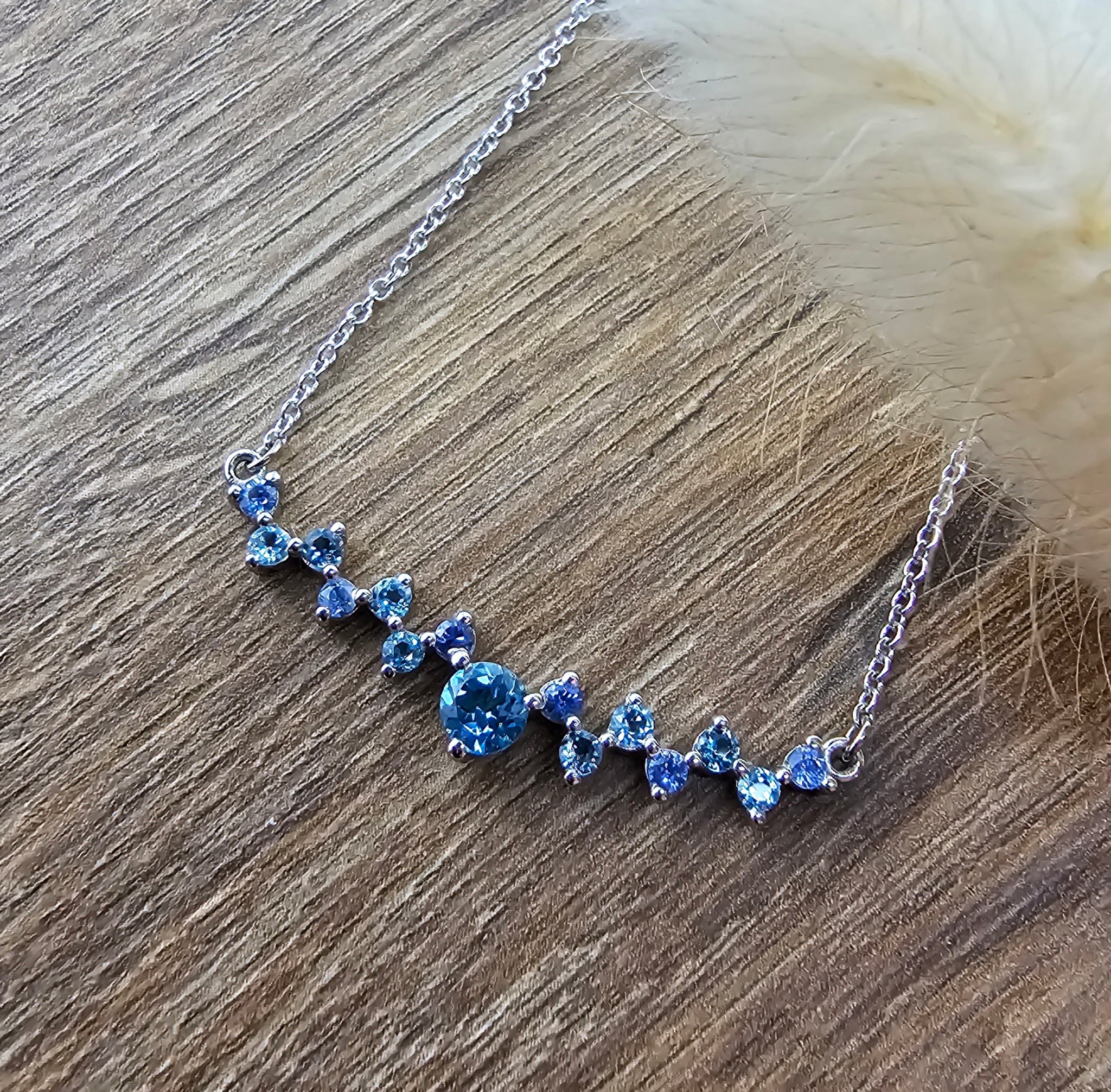Blue topaz and sapphire pendant