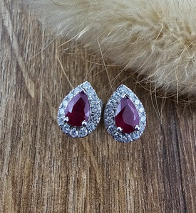 Pear cut ruby halo stud earrings