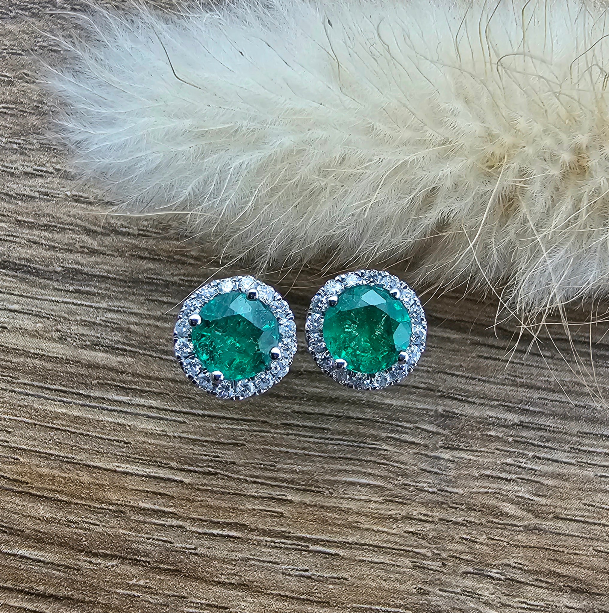 Round emerald halo stud earrings
