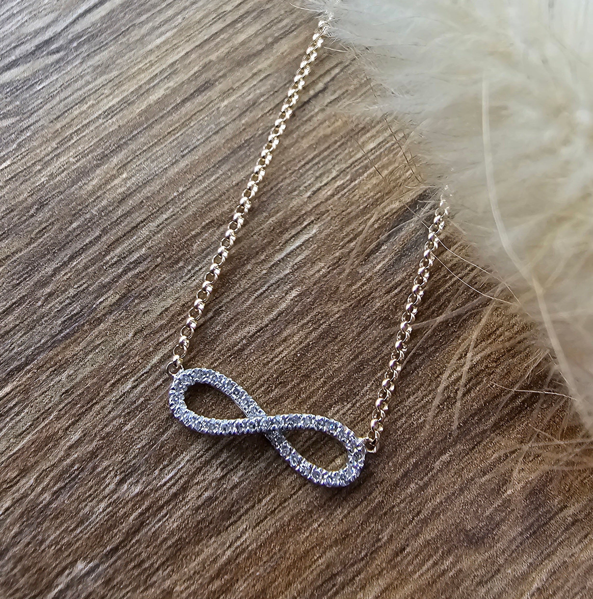 Yellow gold diamond infinity pendant