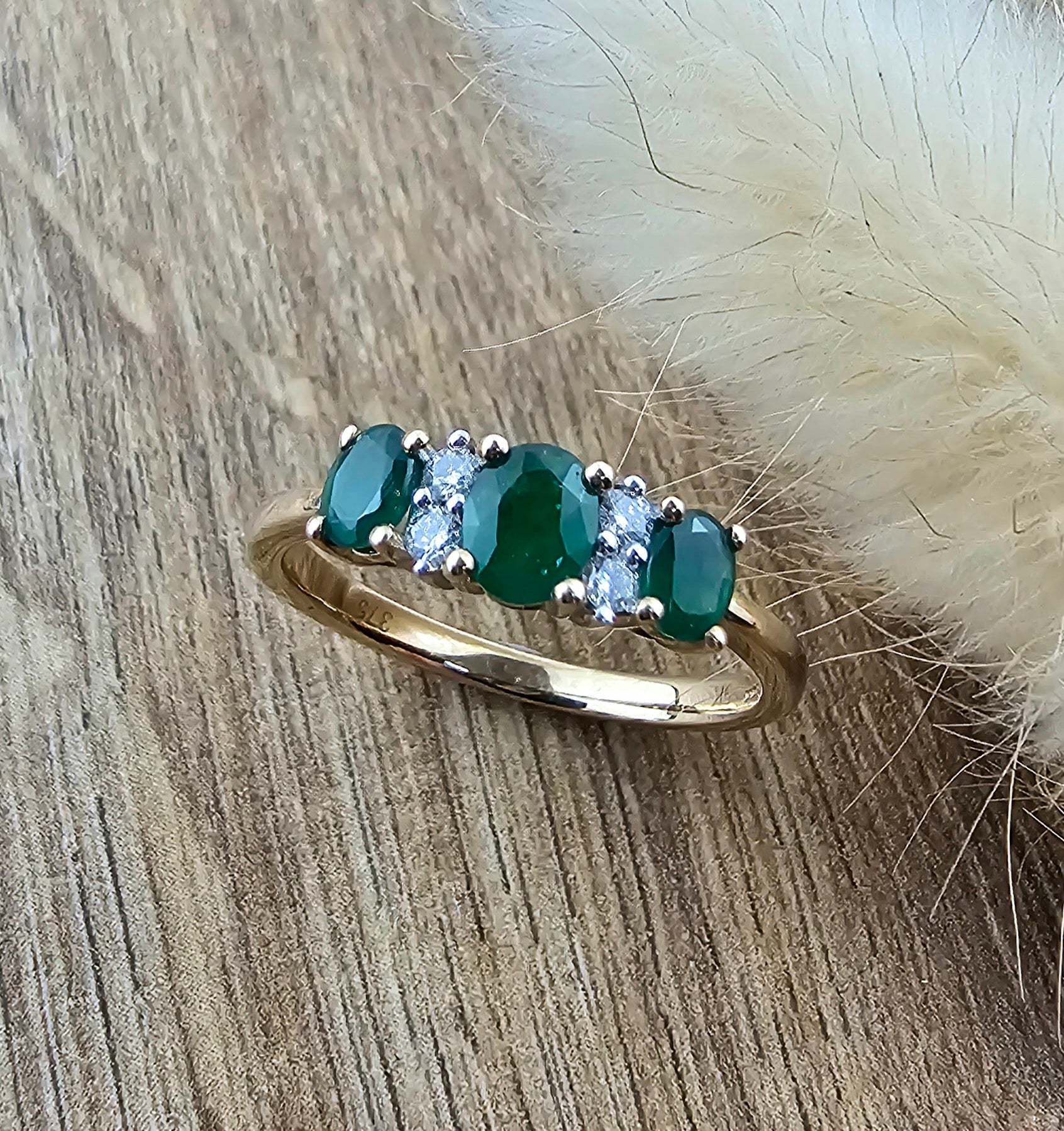Oval triple emerald dress ring
