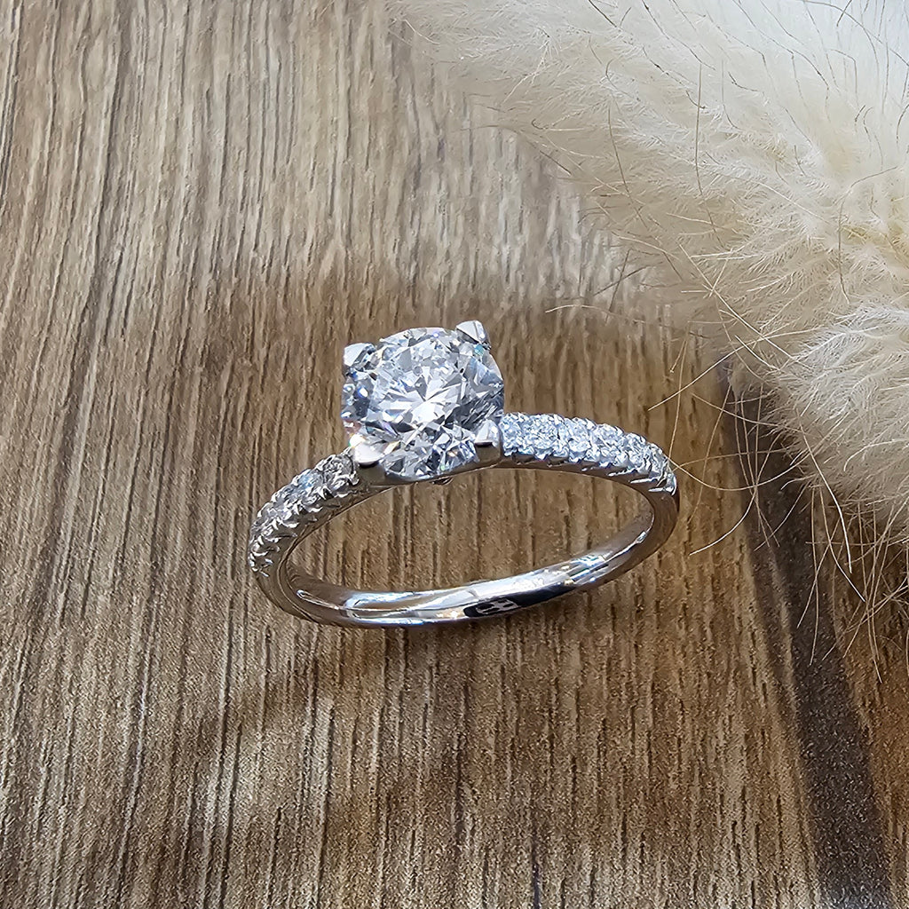 Round diamond solitaire with diamond shoulders