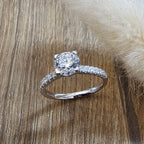 Round diamond solitaire with diamond shoulders