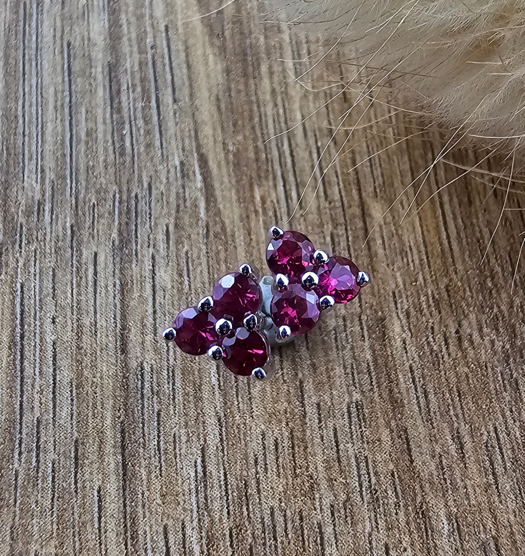 Three stone ruby stud earrings