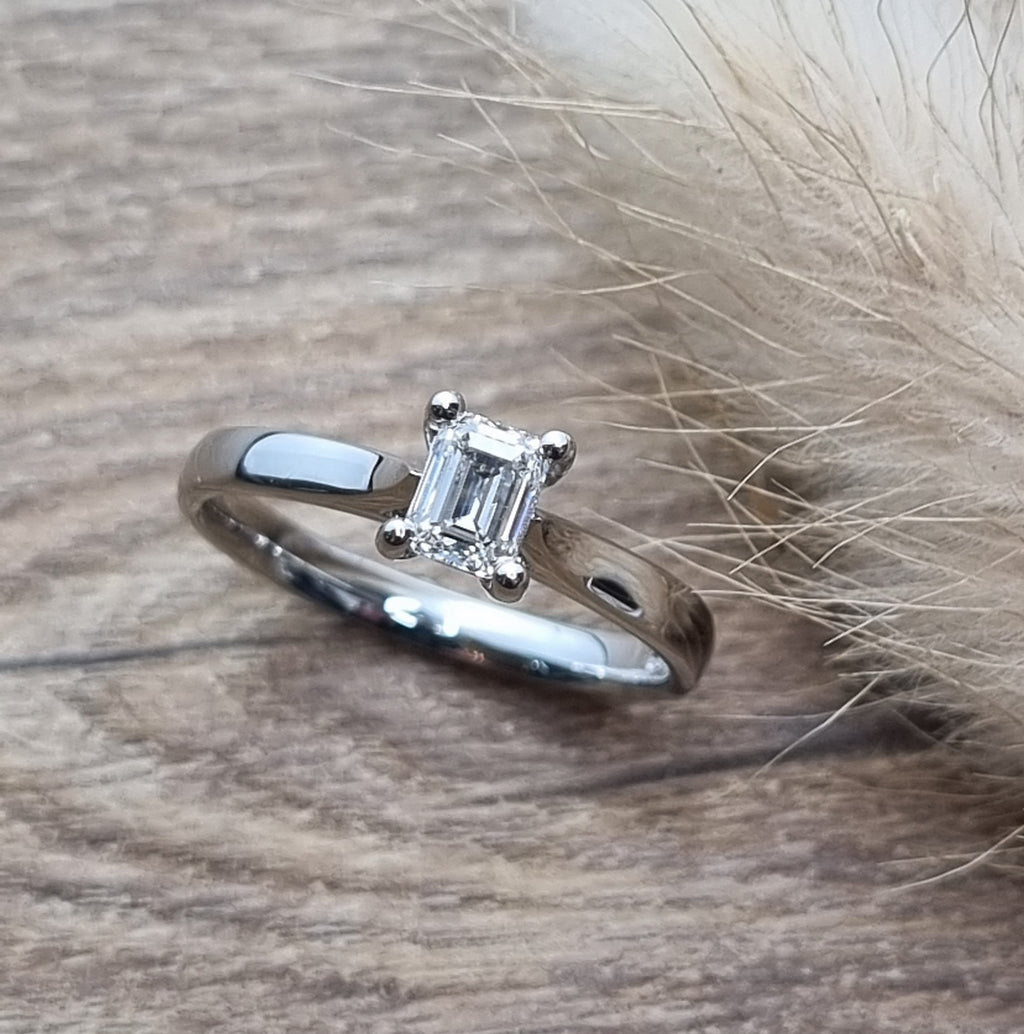 Emerald cut diamond solitaire ring