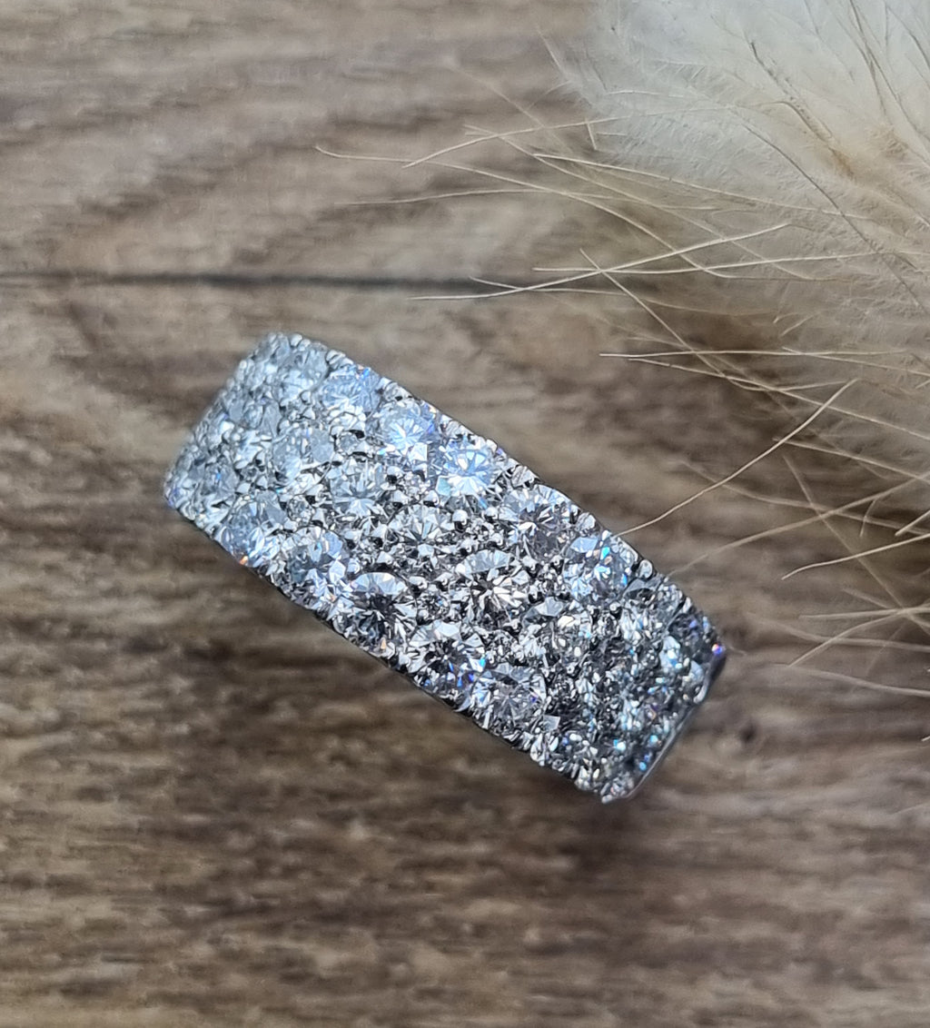 Three row claw set diamond ring