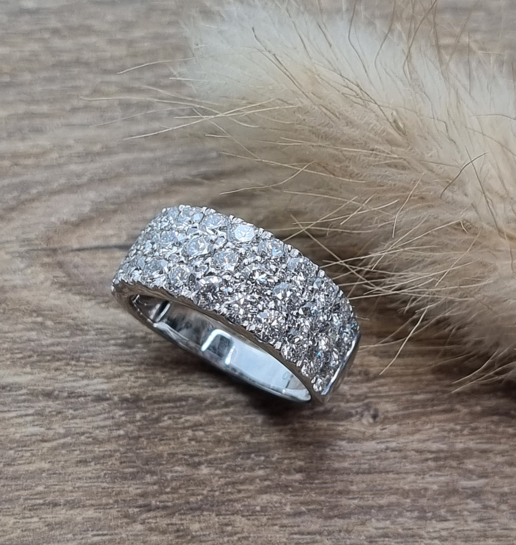 Three row claw set diamond ring