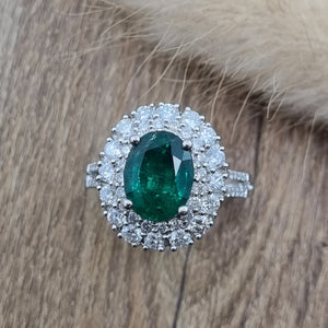 Large oval emerald double halo