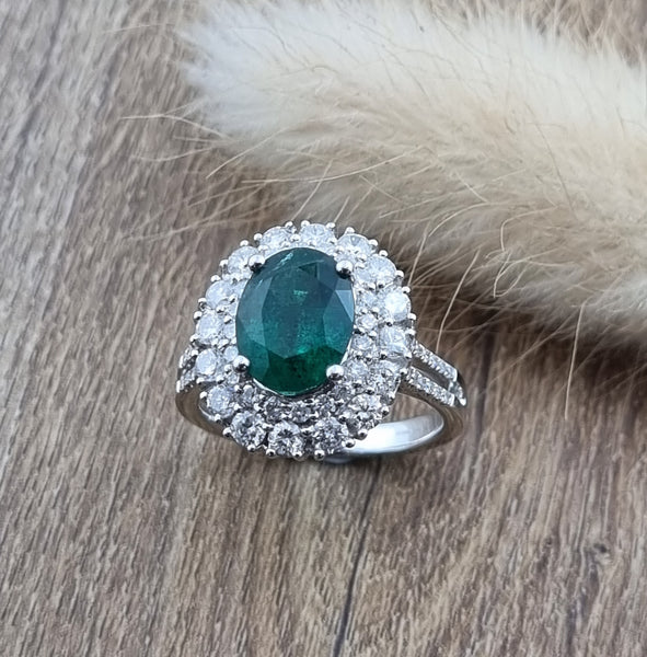 Large oval emerald double halo